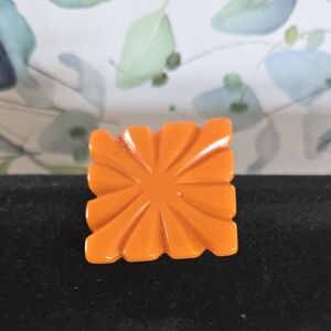 Vintage Orange Bakelight Carved Brooch